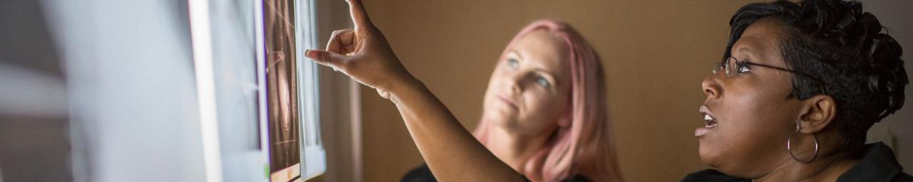 Professor and Student looking at xray.